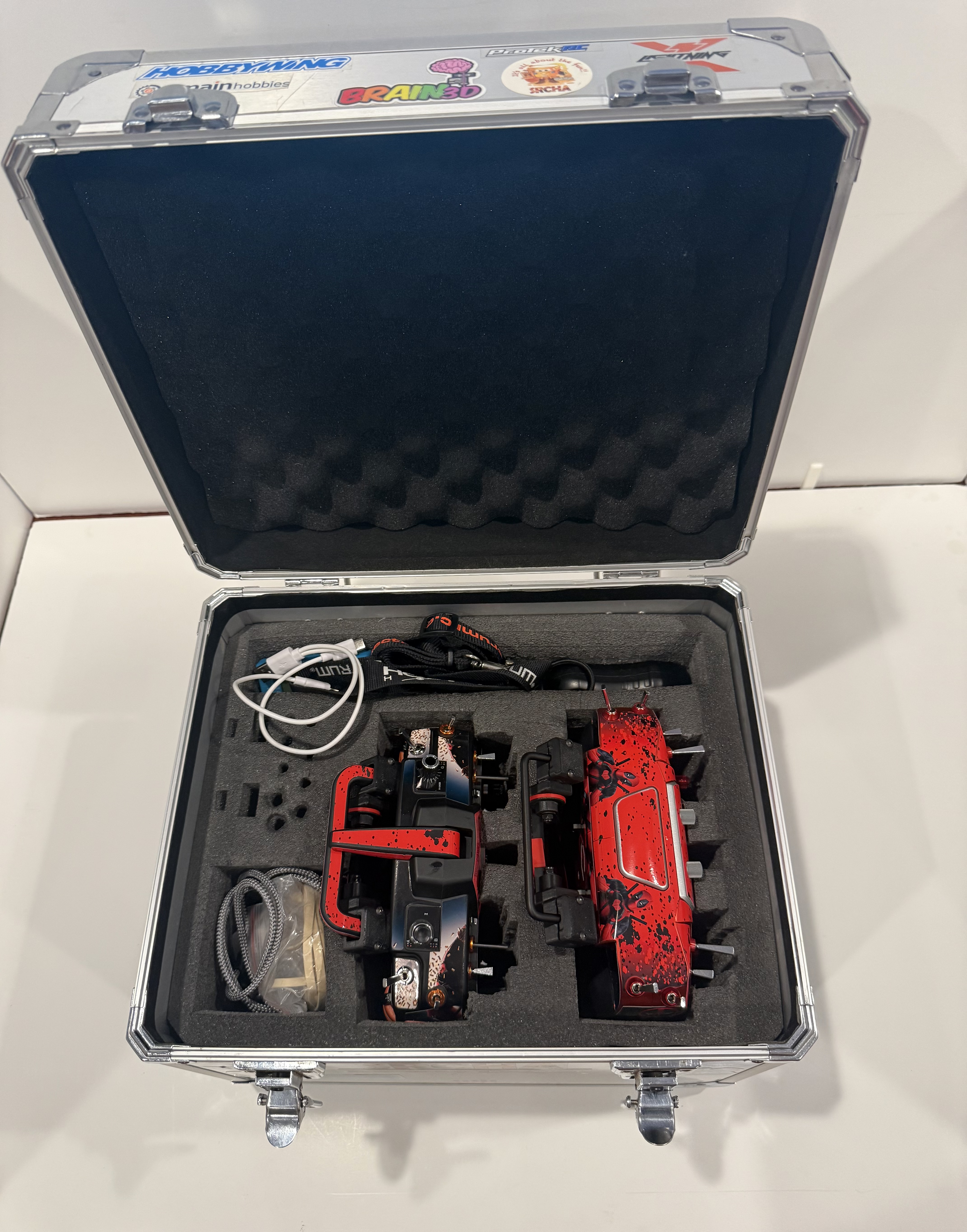 Spirit WAVE transmitter with stand installed inside a Spektrum two-radio carrying case